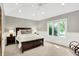 Well-lit bedroom with neutral walls, a large window, a ceiling fan, and a spacious layout at 3862 Penzance Pl, Carmel, IN 46032