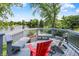 Wonderful outdoor deck with seating area overlooking the pond, a perfect spot for relaxing and entertaining at 3862 Penzance Pl, Carmel, IN 46032