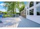 Spacious wood deck, large picture windows, and brick exterior, perfect for outdoor gatherings and entertaining at 3862 Penzance Pl, Carmel, IN 46032