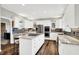 Updated kitchen with stainless appliances, tile backsplash, and granite countertops at 3862 Penzance Pl, Carmel, IN 46032