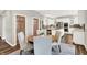 Bright kitchen with stainless steel appliances and granite countertops, seen from the dining table at 3862 Penzance Pl, Carmel, IN 46032