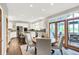 Bright kitchen with stainless steel appliances, granite countertops, and seating at island at 3862 Penzance Pl, Carmel, IN 46032