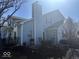 Backyard featuring blue siding, a patio with outdoor seating, and manicured landscaping at 3934 N Lakeside Dr, Muncie, IN 47304