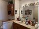 Bathroom features a vanity with storage, lighting, and vintage-style decorations at 3934 N Lakeside Dr, Muncie, IN 47304