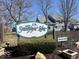 The entrance to Sandpiper Lakes with attractive signage surrounded by manicured landscaping at 3934 N Lakeside Dr, Muncie, IN 47304