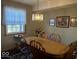 Cozy dining room featuring a wooden table with chairs and a charming light fixture, ideal for Gathering meals at 3934 N Lakeside Dr, Muncie, IN 47304