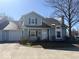 Charming two-story home with a well-maintained front yard and attached garage, perfect for suburban living at 3934 N Lakeside Dr, Muncie, IN 47304