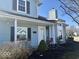 Charming home with front entrance, covered porch, and well-maintained landscaping at 3934 N Lakeside Dr, Muncie, IN 47304