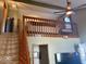 View of living room with staircase to the loft and hardwood trim around doors at 3934 N Lakeside Dr, Muncie, IN 47304