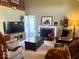 Inviting living room featuring a fireplace, TV, and comfortable seating, perfect for relaxation at 3934 N Lakeside Dr, Muncie, IN 47304