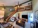 Cozy living room with high ceilings, a staircase, and a comfortable seating area at 3934 N Lakeside Dr, Muncie, IN 47304