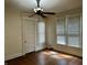 Bedroom featuring hardwood floors, two windows with blinds, ceiling fan and closet at 418 N Drexel Ave, Indianapolis, IN 46201