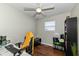 Bright bedroom featuring wood floors, a ceiling fan, and a window at 4414 Lexington Ave, Indianapolis, IN 46203