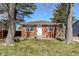Charming brick ranch home with a well-manicured lawn and mature trees at 4414 Lexington Ave, Indianapolis, IN 46203