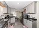 Modern kitchen with stainless steel appliances and convenient access to the dining area at 4414 Lexington Ave, Indianapolis, IN 46203