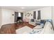 Comfortable living room features hardwood floors and neutral tones at 4414 Lexington Ave, Indianapolis, IN 46203