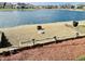 Beautiful backyard with a lakeside fire pit area, perfect for outdoor entertaining and enjoying tranquil water views at 4414 Princeton Park Dr, Columbus, IN 47201