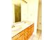 Bright bathroom with double sinks, wood cabinets, and a separate shower at 4414 Princeton Park Dr, Columbus, IN 47201