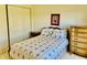 Bedroom features classic design with floral patterned comforter and natural light at 4414 Princeton Park Dr, Columbus, IN 47201