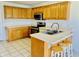 Bright kitchen features light countertops, wood cabinets, and stainless steel appliances at 4414 Princeton Park Dr, Columbus, IN 47201
