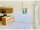 Eat-in kitchen area with chandelier, bar stool seating, and a window at 4414 Princeton Park Dr, Columbus, IN 47201