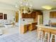 An open concept kitchen features an adjacent seating area and bright, natural light at 4414 Princeton Park Dr, Columbus, IN 47201