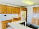 A view of the kitchen's ample cabinet and counter space, with stainless steel sink fixture at 4414 Princeton Park Dr, Columbus, IN 47201