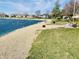 Enjoy access to a private beach and lakeside lounging area, perfect for relaxing by the water's edge at 4414 Princeton Park Dr, Columbus, IN 47201