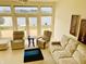 Spacious living room with neutral decor and large windows overlooking the water at 4414 Princeton Park Dr, Columbus, IN 47201