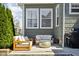 Back patio features comfortable outdoor furniture and grill at 4850 Guilford Ave, Indianapolis, IN 46205