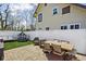 Fenced in back yard with brick patio, outdoor furniture, and playhouse at 4850 Guilford Ave, Indianapolis, IN 46205