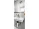 Bathroom sink with silver faucet, a mirror, and a window with natural light at 4850 Guilford Ave, Indianapolis, IN 46205