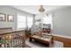 Well-decorated room featuring play structures, toys, books, and an overhead light fixture at 4850 Guilford Ave, Indianapolis, IN 46205