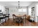Bright dining area featuring hardwood floors and modern lighting at 4850 Guilford Ave, Indianapolis, IN 46205