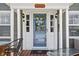 Close-up of front door with decorative wreath, sidelights, and the house number displayed above at 4850 Guilford Ave, Indianapolis, IN 46205