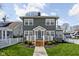 Charming two-story home featuring a welcoming front porch and well-maintained landscaping at 4850 Guilford Ave, Indianapolis, IN 46205