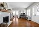 Spacious living room with fireplace, hardwood floors, and ample natural light at 4850 Guilford Ave, Indianapolis, IN 46205