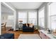 Cozy playroom featuring hardwood floors, natural light, and comfortable seating at 4850 Guilford Ave, Indianapolis, IN 46205