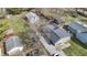 Aerial shot of the house with a gray roof, an extra long driveway, and a detached garage at 5110 Chelsea Rd, Indianapolis, IN 46241