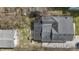 Birds eye view of house with dark roof, small yard, and gravel driveway at 5110 Chelsea Rd, Indianapolis, IN 46241