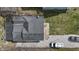 Aerial view shows a gray roof and small yard and gravel driveway at 5110 Chelsea Rd, Indianapolis, IN 46241