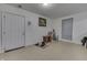 Open living space featuring neutral walls, a white door, and tile flooring at 5110 Chelsea Rd, Indianapolis, IN 46241