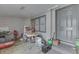 View of the gray front door and porch area with tools and household items stored there at 5110 Chelsea Rd, Indianapolis, IN 46241