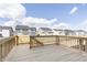 A view of the spacious wooden back deck with views of the neighborhood at 5314 Noble Crossing W Pkwy, Noblesville, IN 46062
