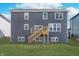 Backyard features new construction home with wood deck and grassy area at 5314 Noble Crossing W Pkwy, Noblesville, IN 46062