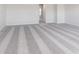 Spacious bedroom featuring new gray carpet with decorative stripes and bright trim at 5314 Noble Crossing W Pkwy, Noblesville, IN 46062