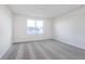 Bedroom featuring new gray carpet and a large window offering ample natural light at 5314 Noble Crossing W Pkwy, Noblesville, IN 46062
