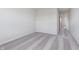 Bright bedroom features plush gray carpeting and a doorway at 5314 Noble Crossing W Pkwy, Noblesville, IN 46062