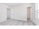Bedroom with gray striped carpet featuring multiple doors, offering easy access to other areas at 5314 Noble Crossing W Pkwy, Noblesville, IN 46062