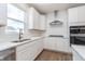 Bright kitchen features stainless appliances, white cabinets and subway tile backsplash at 5314 Noble Crossing W Pkwy, Noblesville, IN 46062